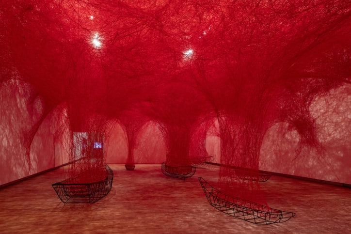 Installation view of the work Uncertain Journey in the exhibition ‘Chiharu Shiota: The Soul Trembles’, Grand Palais, Paris, 2024. Courtesy of GrandPalaisRmn.