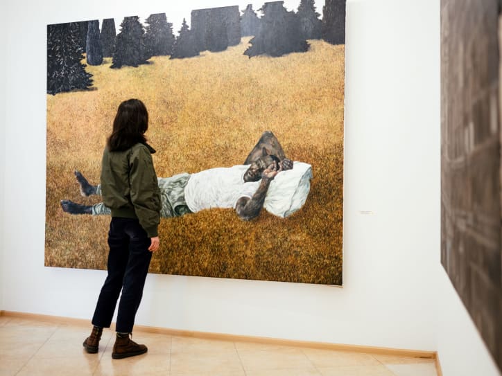 A visitor at Vanda Art Gallery. Photography by Tako Robakidze for Art Basel.