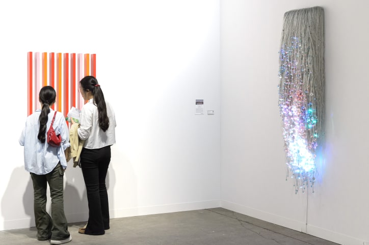 Visitors in Gallery Baton's booth at Art Basel Hong Kong 2025.