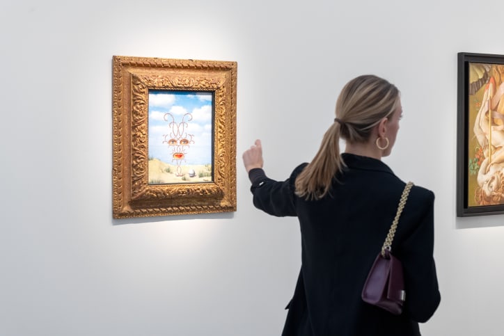 A visitor in Lévy Gorvy Dayan's booth at Art Basel Paris 2025.
