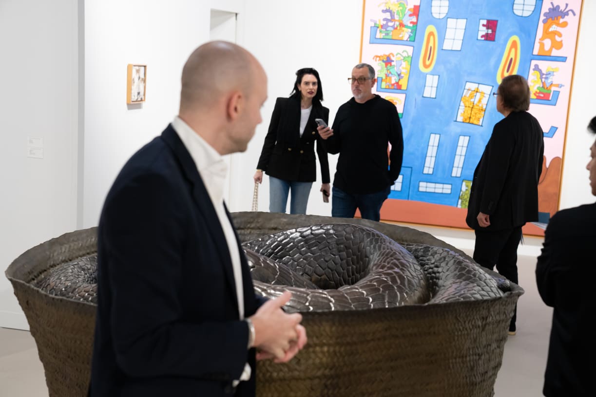 Gladstone Gallery's booth at Art Basel Miami Beach 2024, with Wangechi Mutu’s bronze sculpture Nyoka (2022) and Keith Haring's painting Untitled (1984).