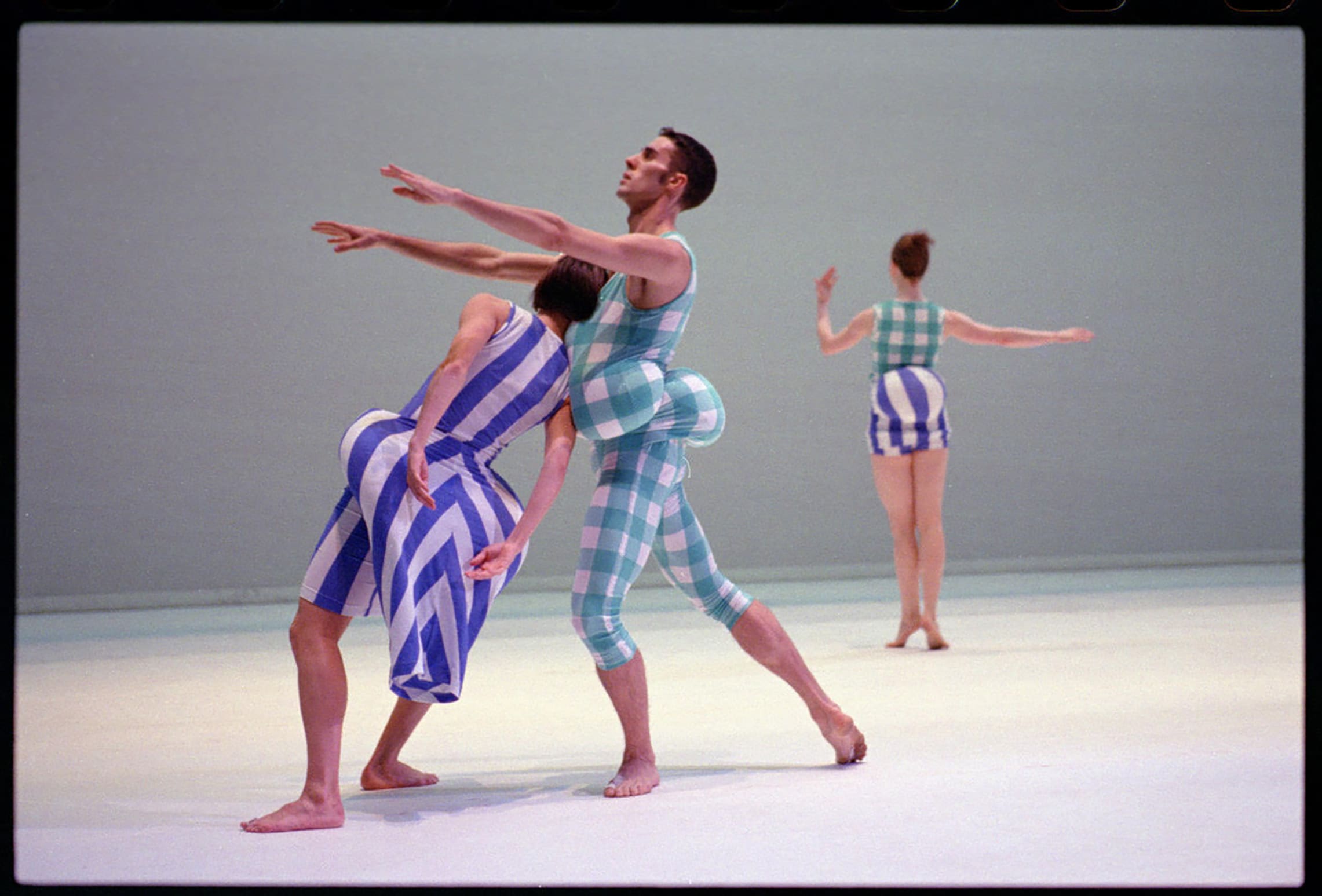 Jean Freebury, Matthew Mohr and Holley Farmer of the Merce Cunningham Dance Company in Scenario. Costumes by Rei Kawakubo. Portrait by © 1997 Timothy Greenfield-Sanders. All Rights Reserved. Courtesy of the photographer.