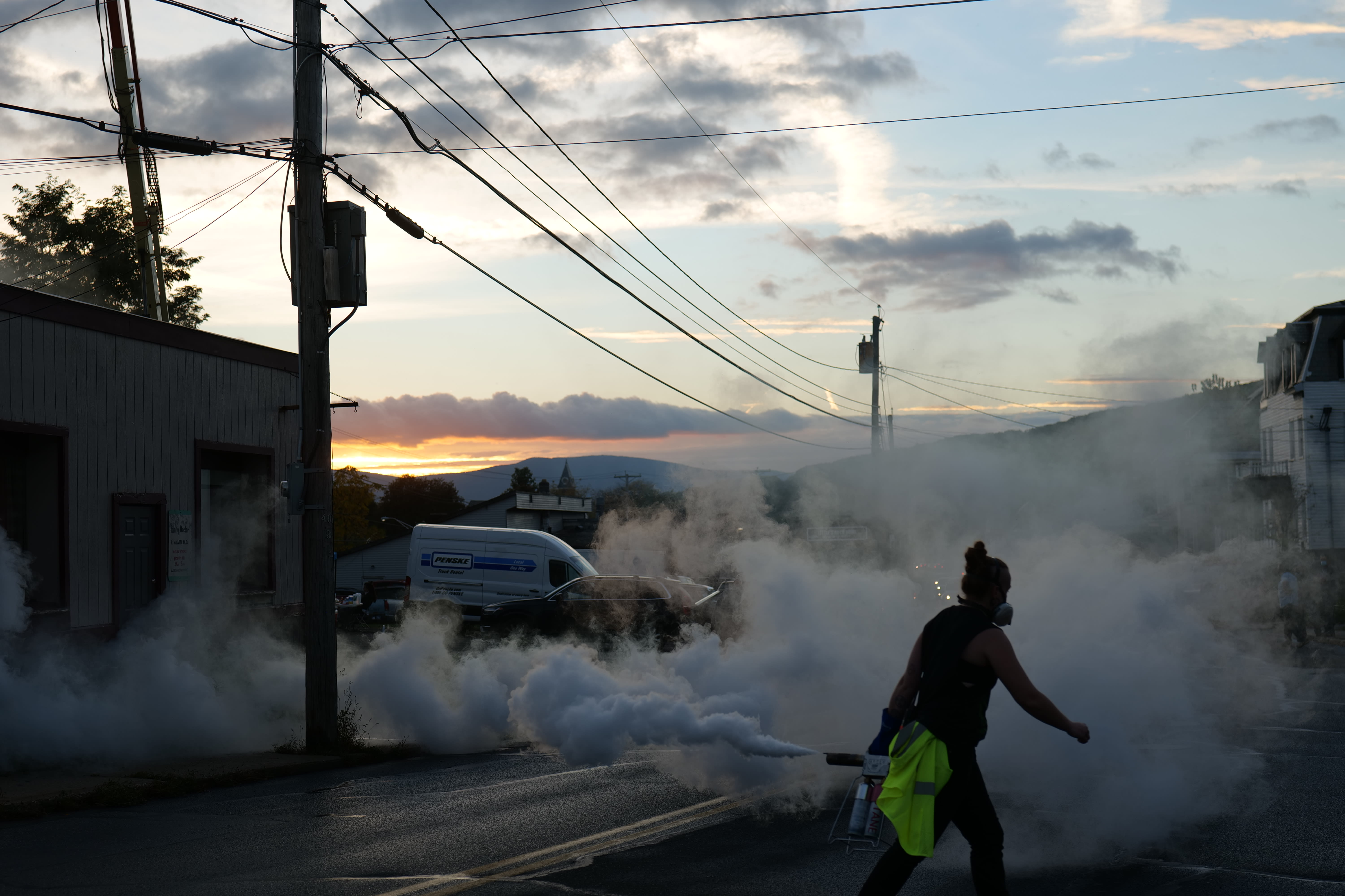 Production still: Adrianne Davis, Art Department, creates fog on the set of The Family Doctor, 2021. Photograph by Harper Glantz © Crewdson Studio