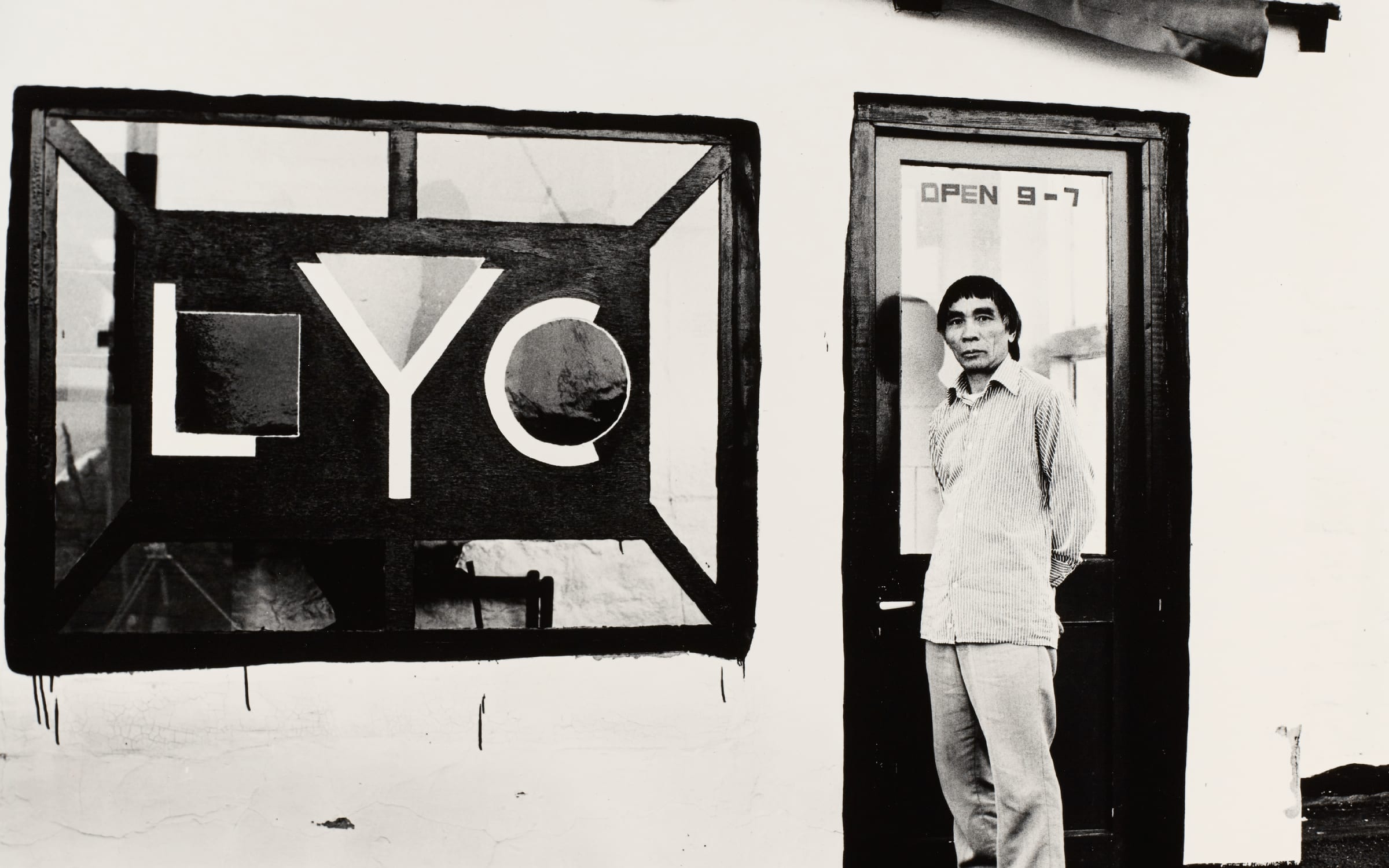 Li Yuan-chia standing at the porch of the LYC Museum & Art Gallery, featuring window designed by David Nash. Courtesy of Li Yuan-chia Archive, The University of Manchester Library.