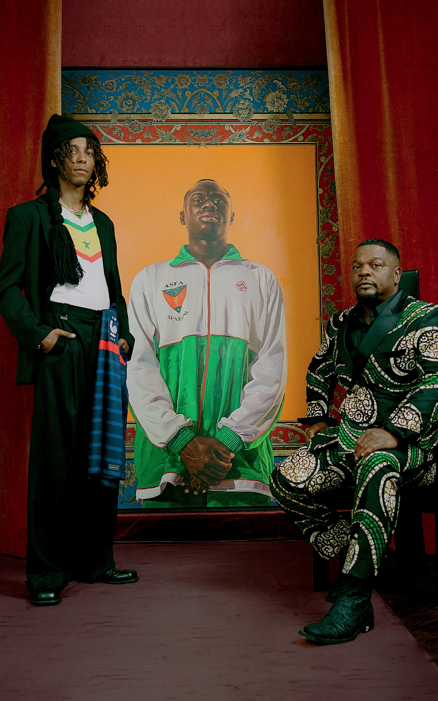 Alexandre Diop and his mentor Kehinde Wiley in front of one of latter's artworks, Idrissa Ndiaye (2012). Photograph by Kenny Germé, styling by Kevin Lanoy. Courtesy of Templon. 
