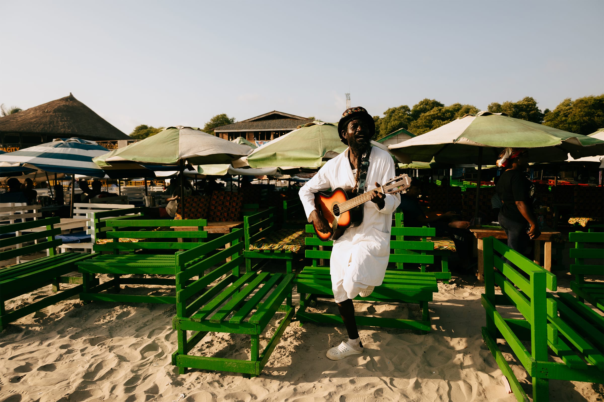 A musician on the beach in Accra. Photography by Rachel Seidu for Art Basel.