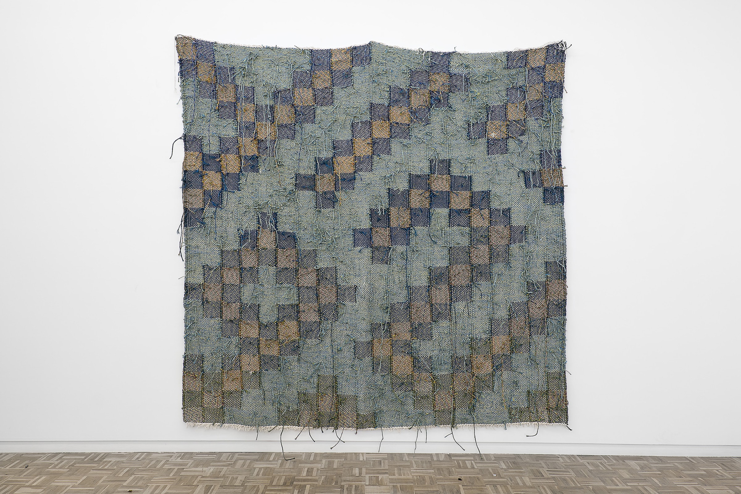 Installation view of Igshaan Adams, Akbar, 2017, in ‘To Weave the Sky: Textile Abstractions in the Jorge M. Pérez Collection’. Courtesy of El Espacio 23.