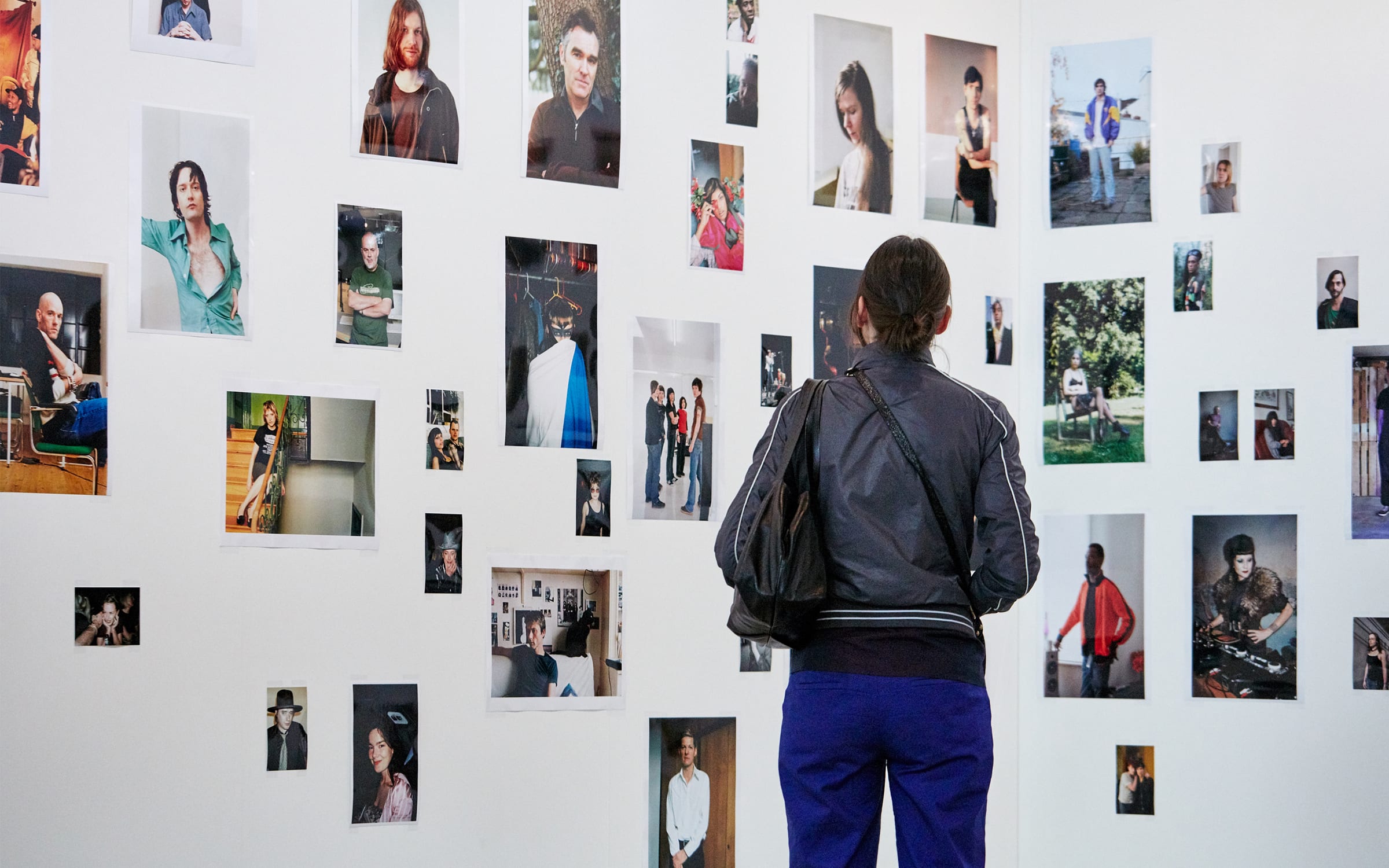 A visitor in front of works by Wolfgang Tillmans, presented by Galerie Buchholz at Art Basel's 2019 edition in Basel.