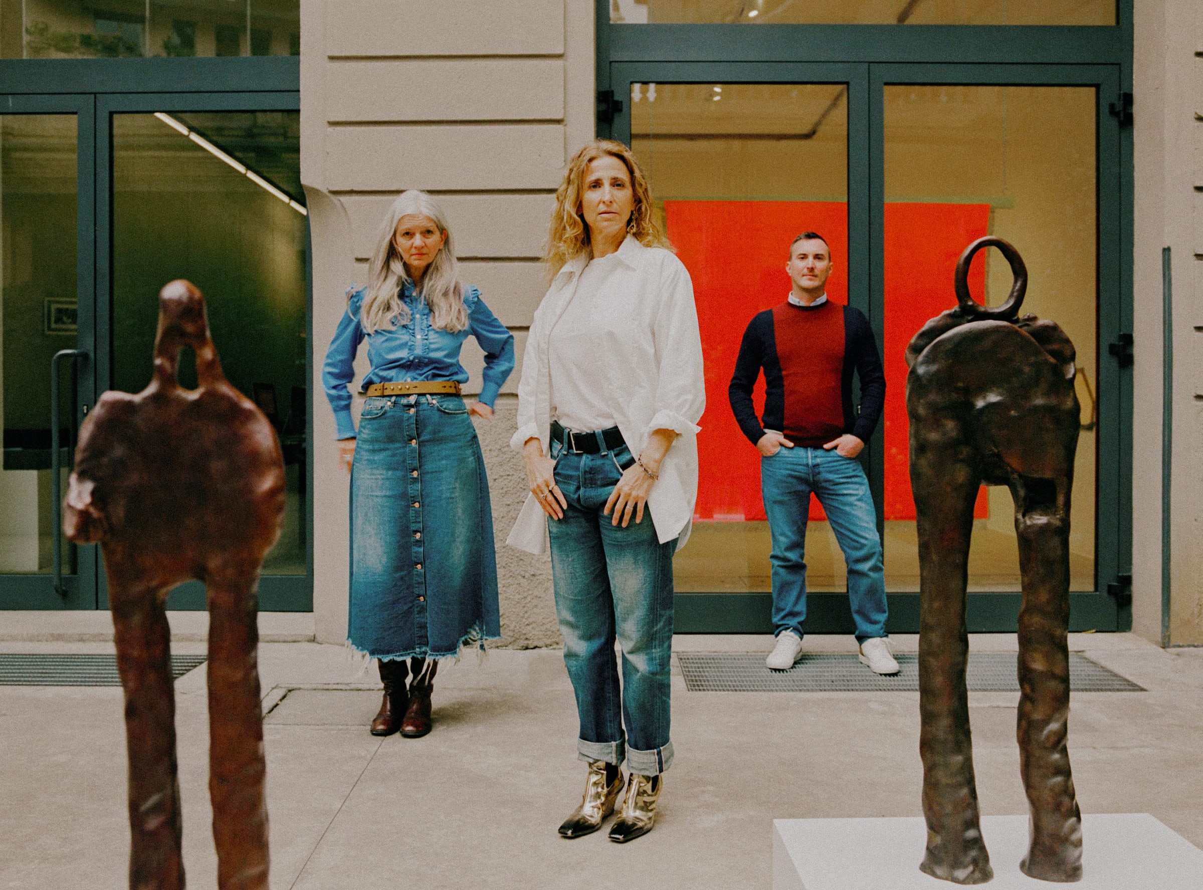 Gallerist Francesca Kaufmann of Kaufmann Repetto with her senior directors, flanked by sculptures by Simone Fattal. Photography by Julius Hirtzberger for Art Basel.
