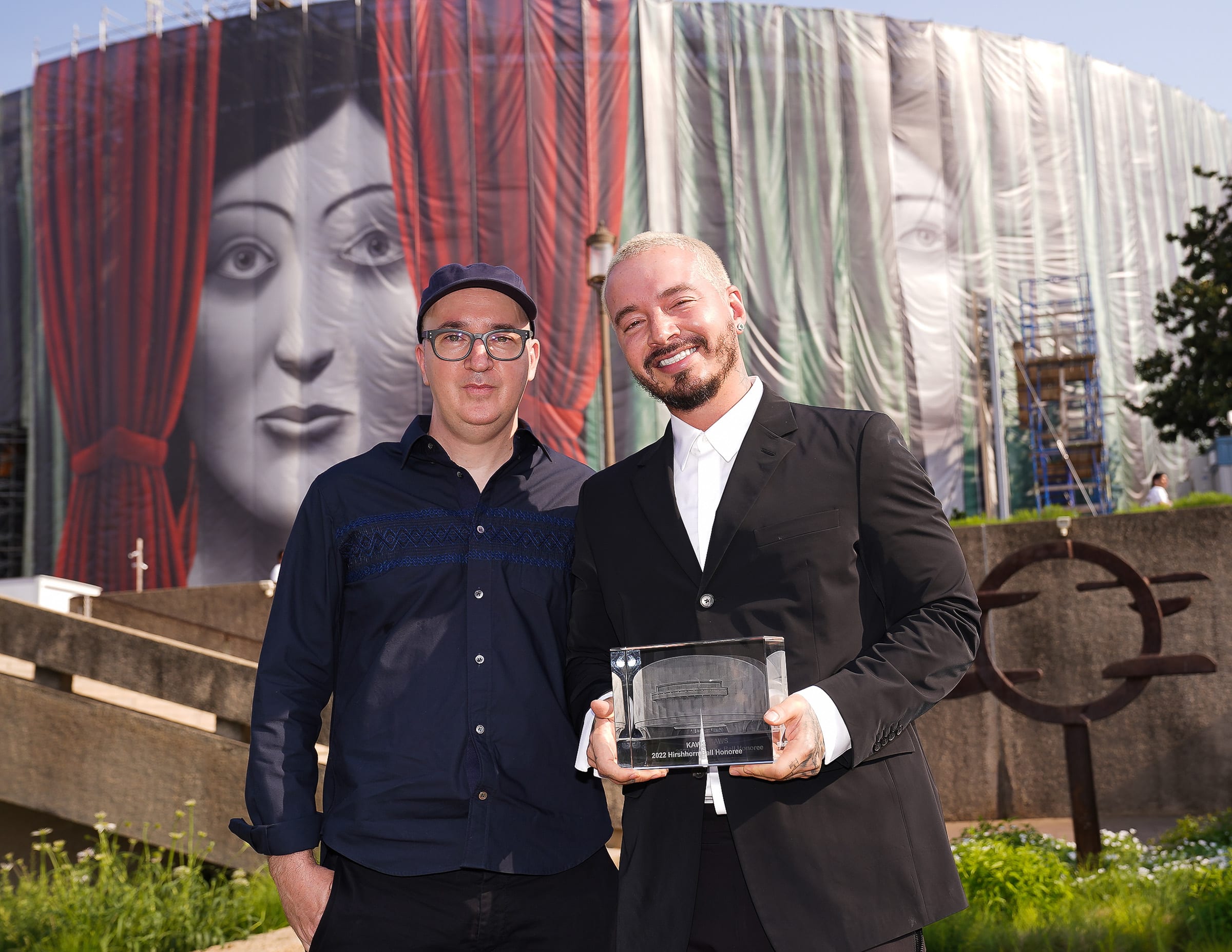 KAWS (left) and J Balvin (right) in the Hirshhorn Sculpture Garden. Courtesy of the Hirshhorn Museum and Sculpture Garden. Photograph by Tony Powell.