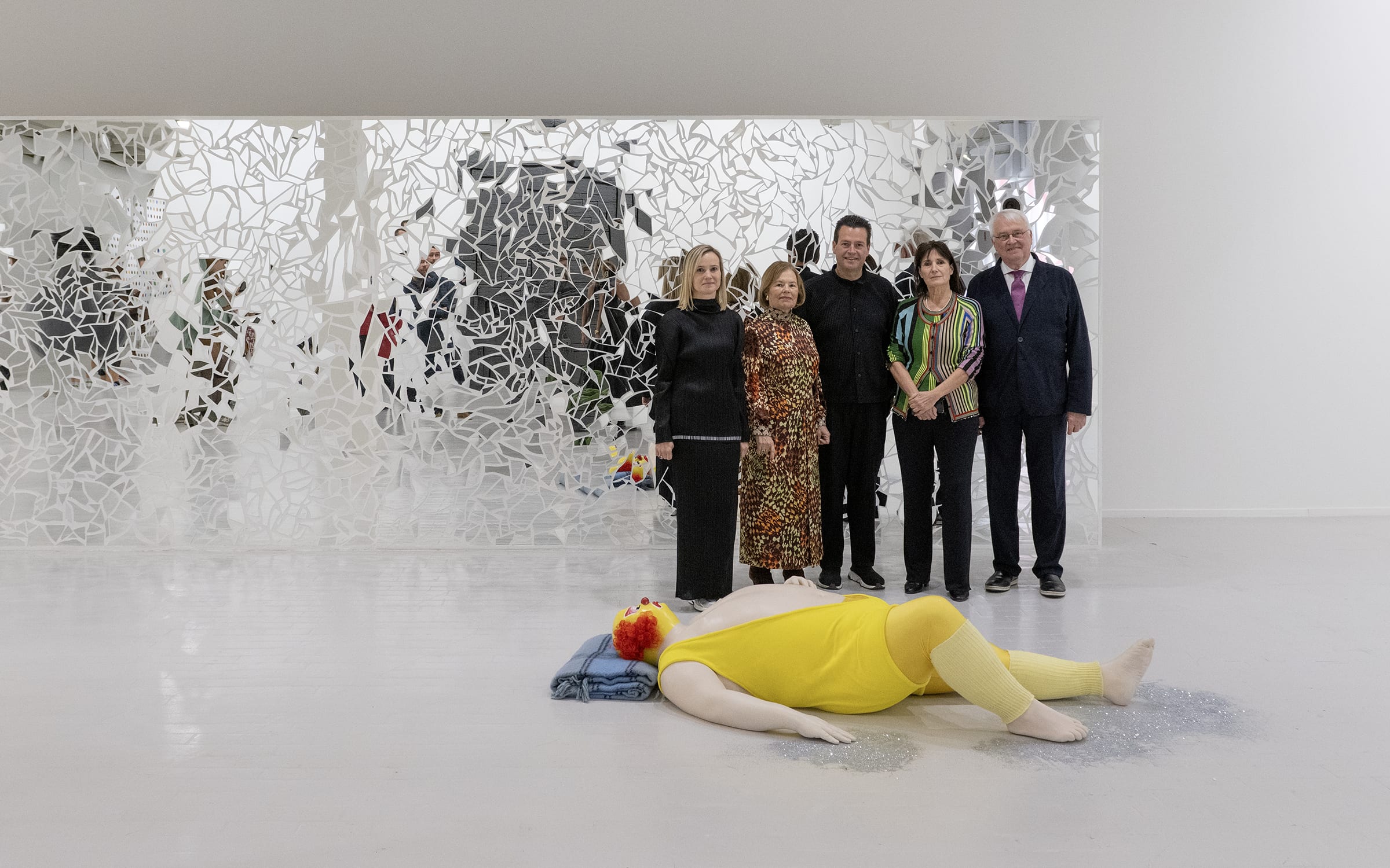 Famille Vanhaerents with Caroline David, curator of Lille3000, next to works by Ugo Rondidone at Tripostal. Photograph by Joost Vanhaerents. Courtesy of the Vanhaerents Art Collection Brussels.     