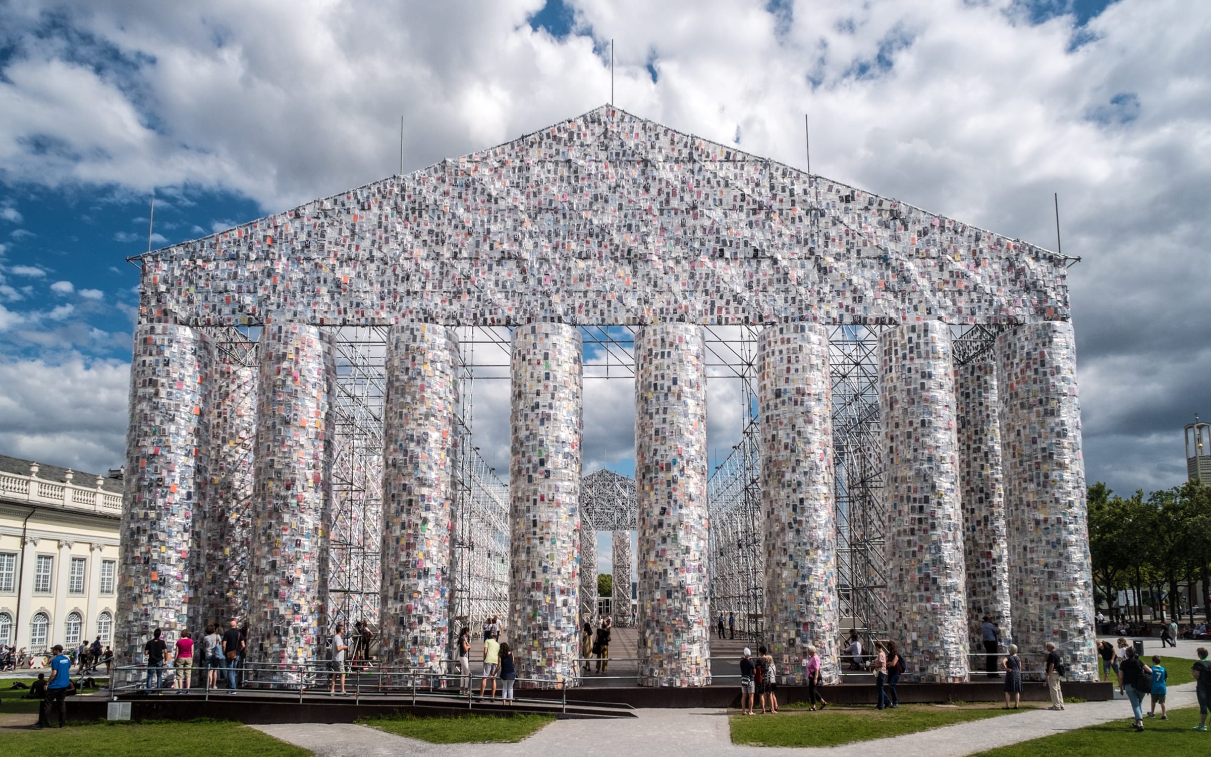 Marta Minujín, The Parthenon of Books, 2017,  steel, books, and plastic sheeting . Friedrichsplatz, Kassel, documenta 14. Courtesy of the artist.