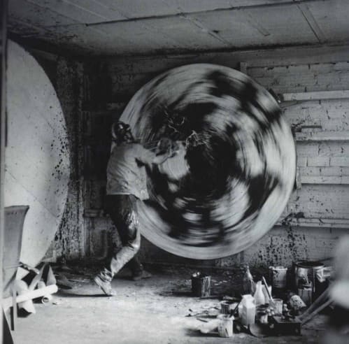 Alfons Schilling in front of a spin painting, Paris