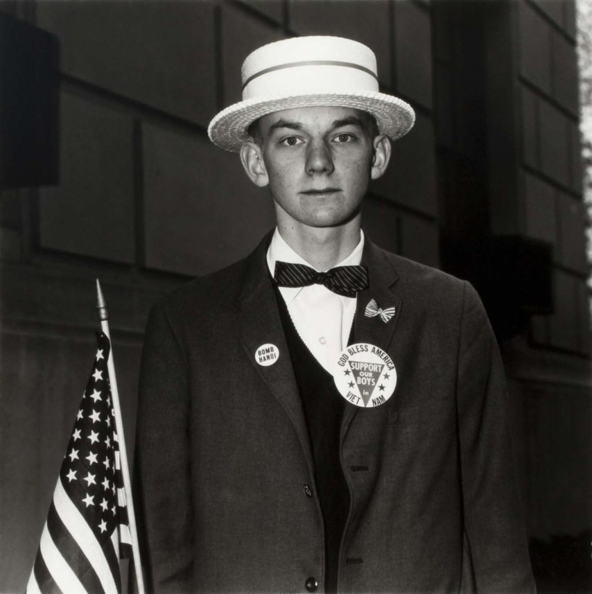 Boy with a Straw Hat Waiting to March in a Pro-War Parade, NYC