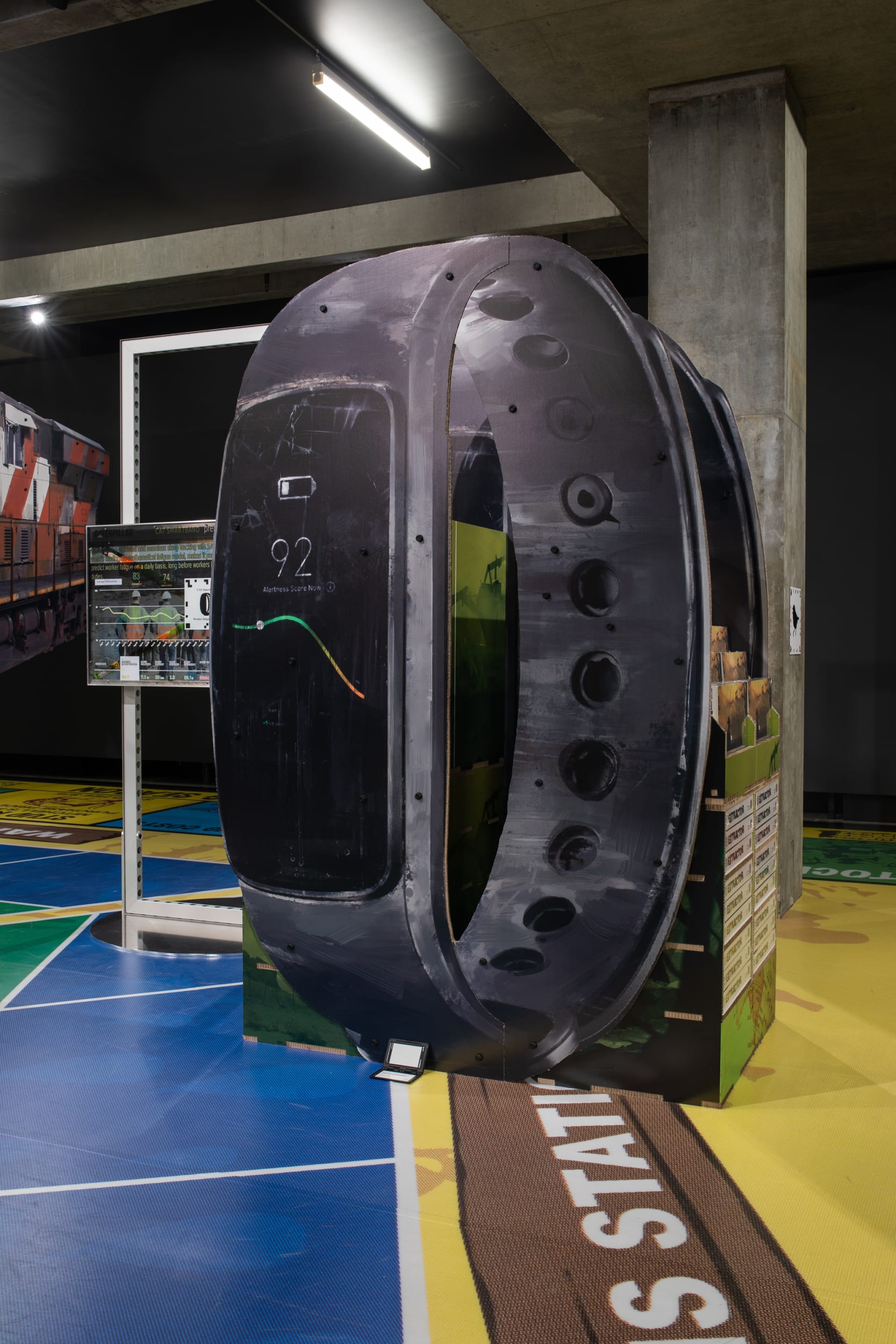 “Caterpillar Biometric worker fatigue monitoring smartband Extractor pop display”