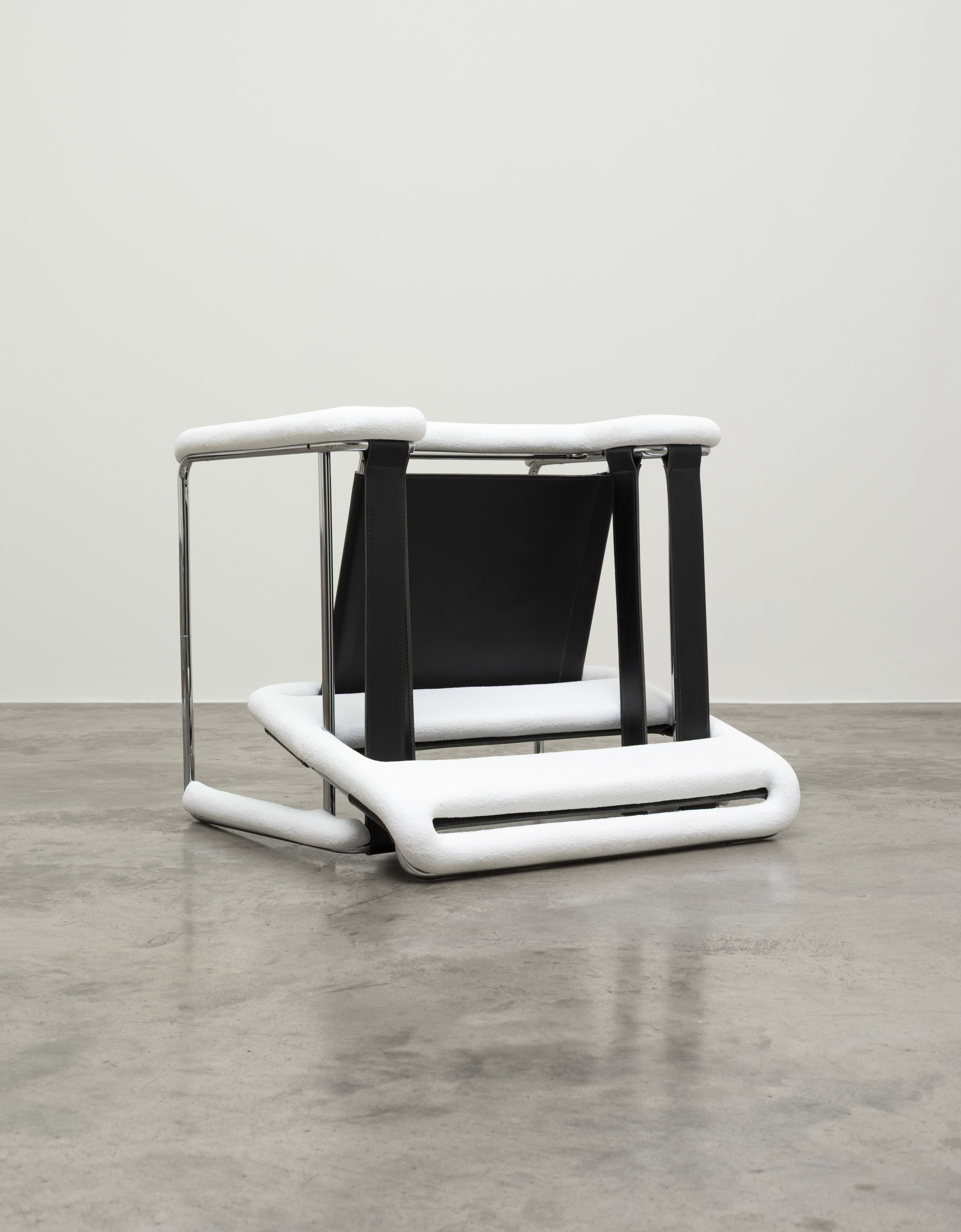 Overturned Breuer chair after a blizzard of snow
